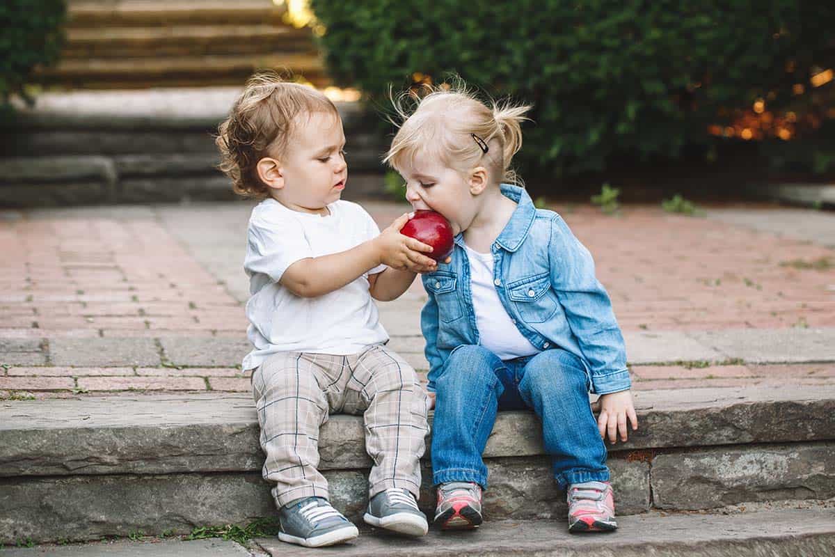 Group portrait of two white Caucasian cute adorable funny childr Share the Love